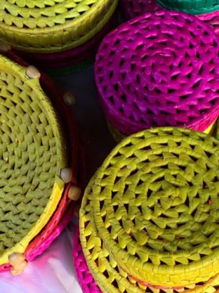 Palm-leaf handicraft being shaped by hand